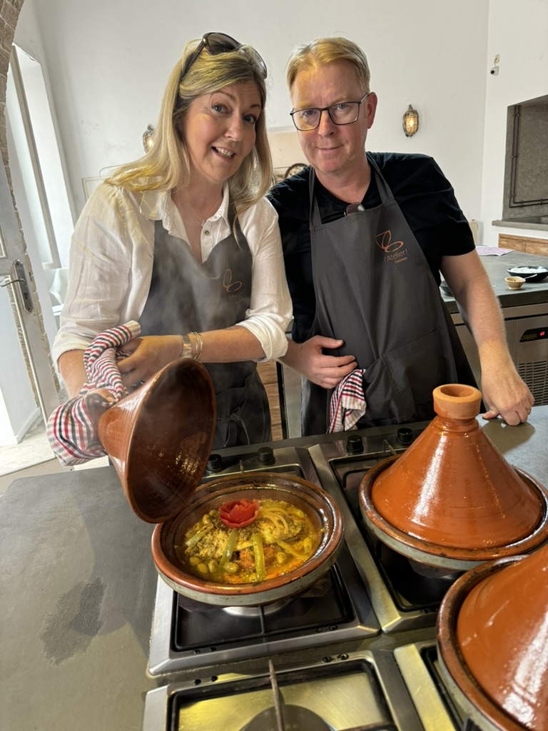 a man and woman cooking with tagines with Annie B in Essaouira