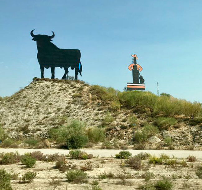 Osborne bull black steel silhouette and Tio Pepe road sign at Cadiz, part of the Sherry tour with Annie B Spain